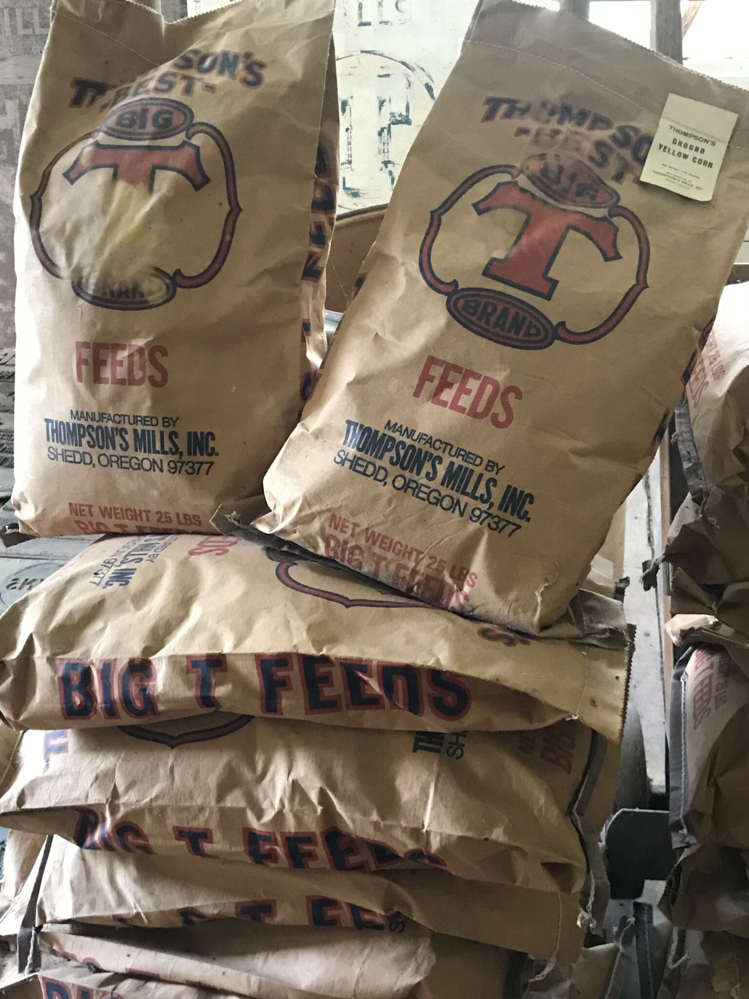 Paper sacks filled with animal feed from Thompson's Mill.