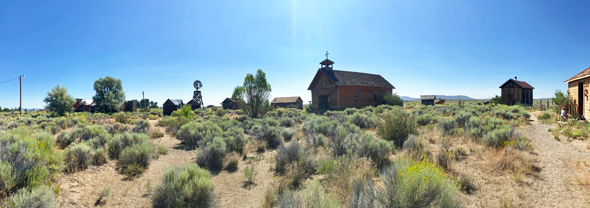 Fort Rock Museum panorama - many old buildings arranged like a settlers village